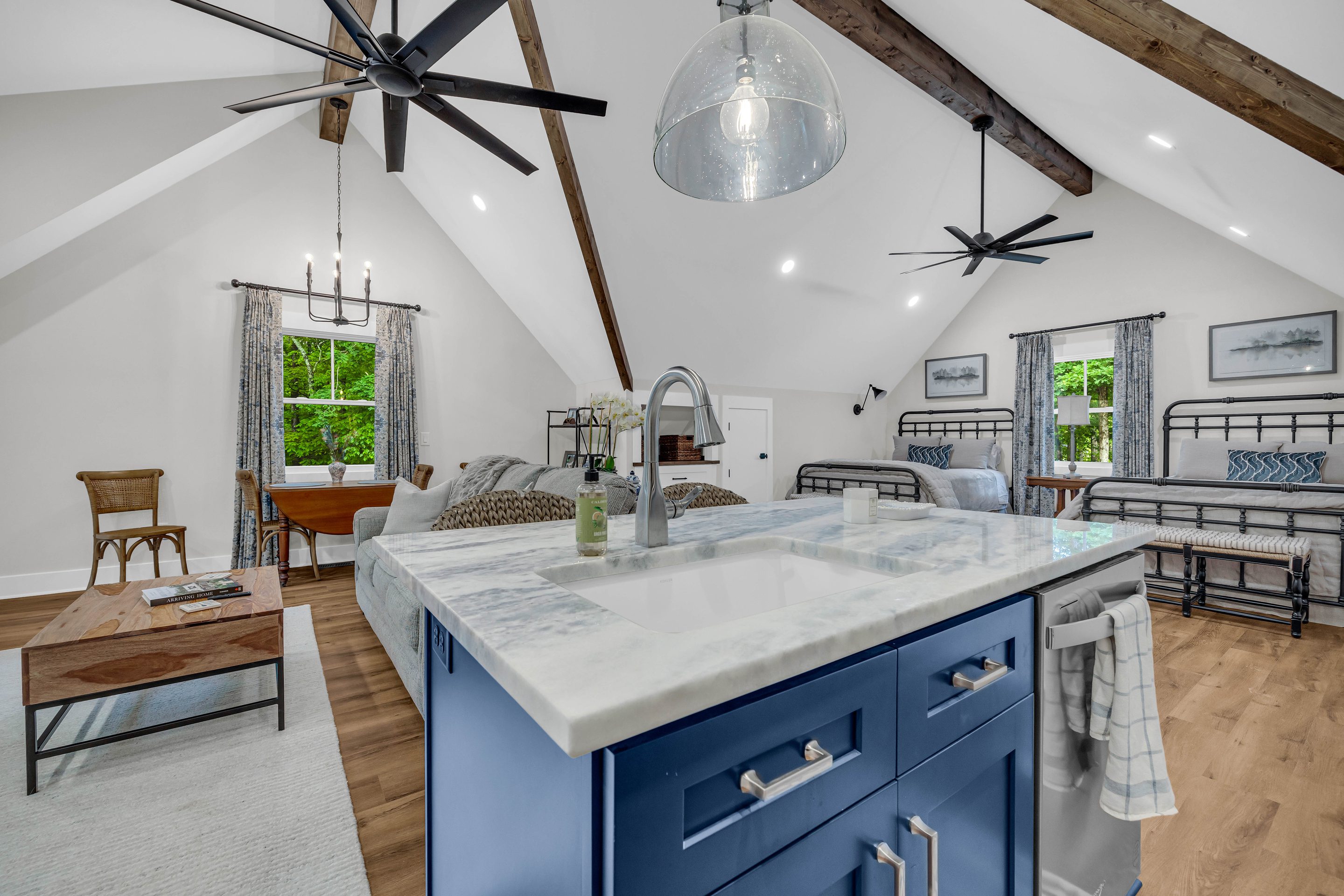 A kitchen with a sink and a counter in it