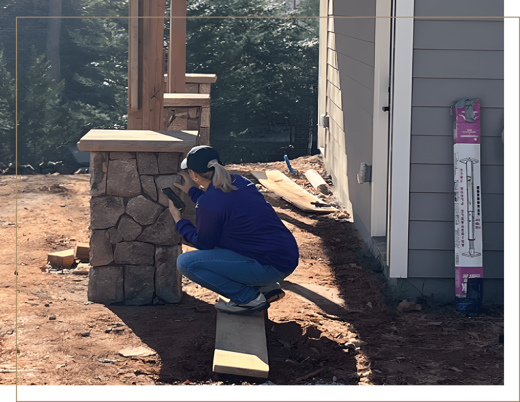 Group 19 A woman sitting on top of a wooden post.